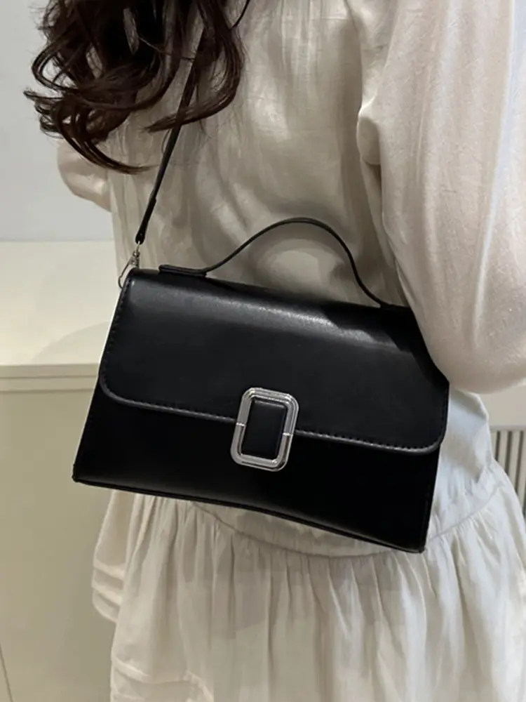 Black Minimalist Shoulder Bag with Silver Clasp - Image 9