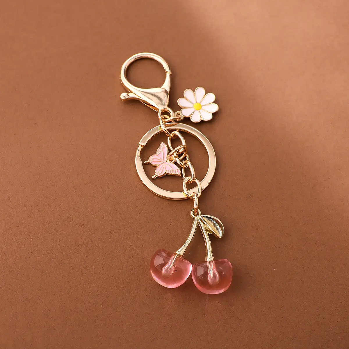 Gold Flower Pendant with Cherry & Butterfly Design - Image 13