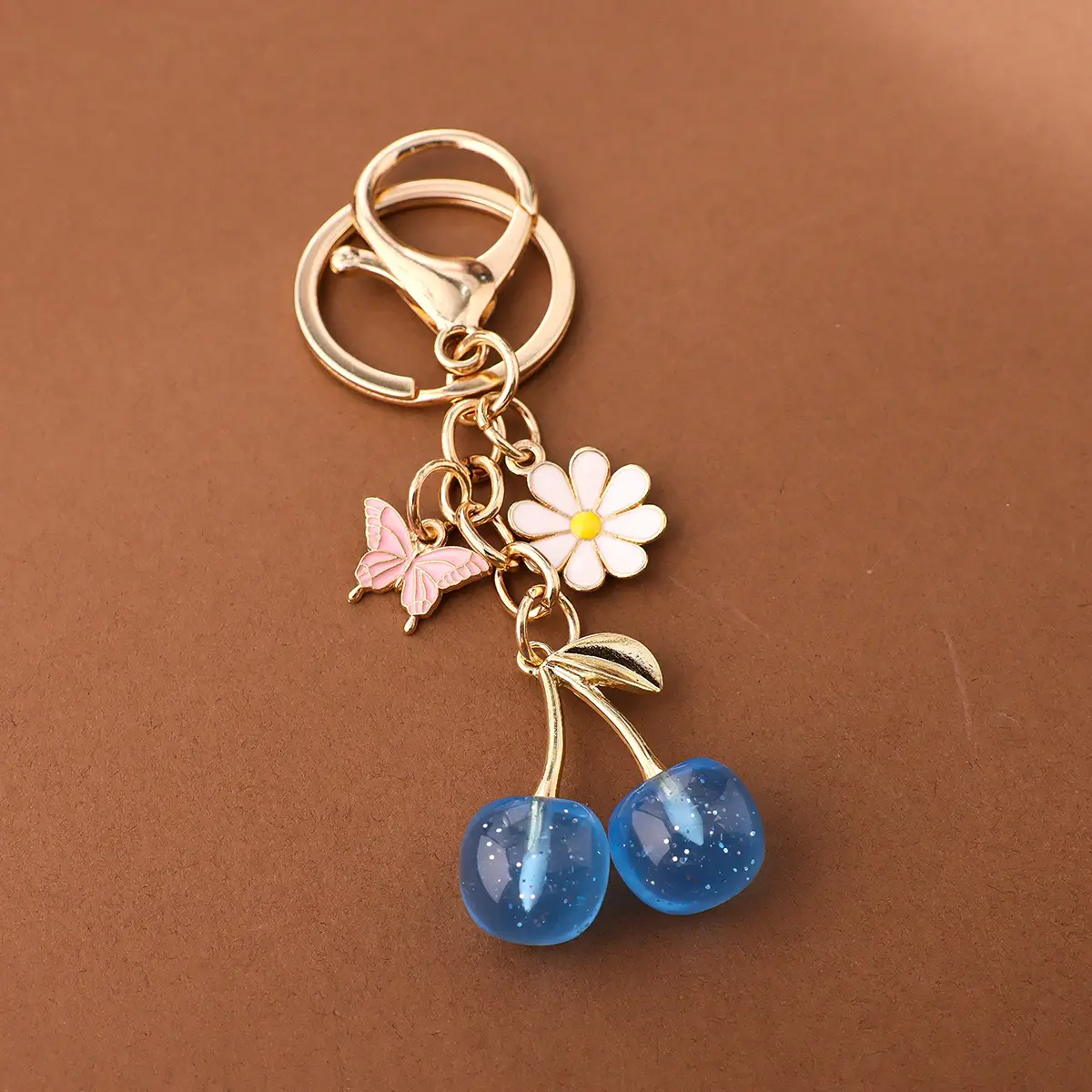Gold Flower Pendant with Cherry & Butterfly Design — feature 8