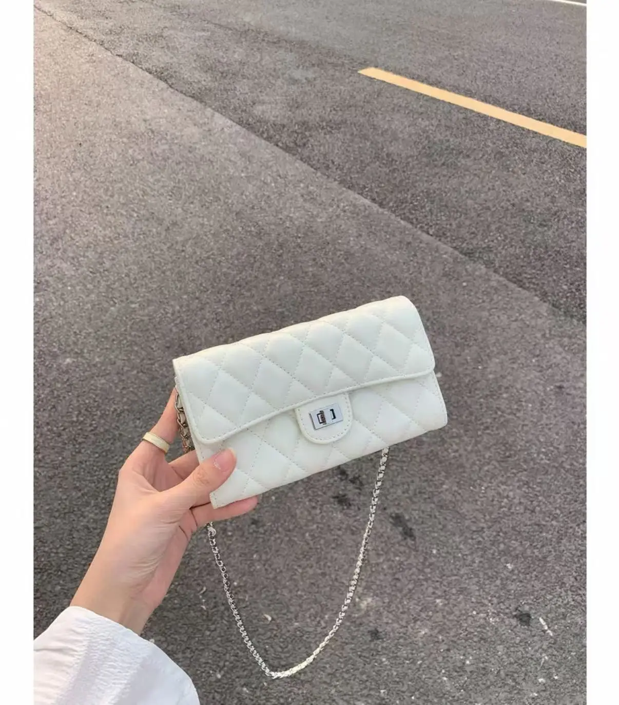 Tweed Off-Shoulder Top with White Clutch & Jeans Set — feature 3