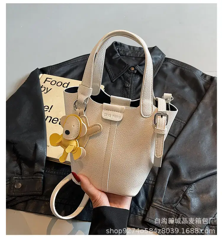 Women's New 2026 Lychee Handbag with Yellow Charm — feature 1