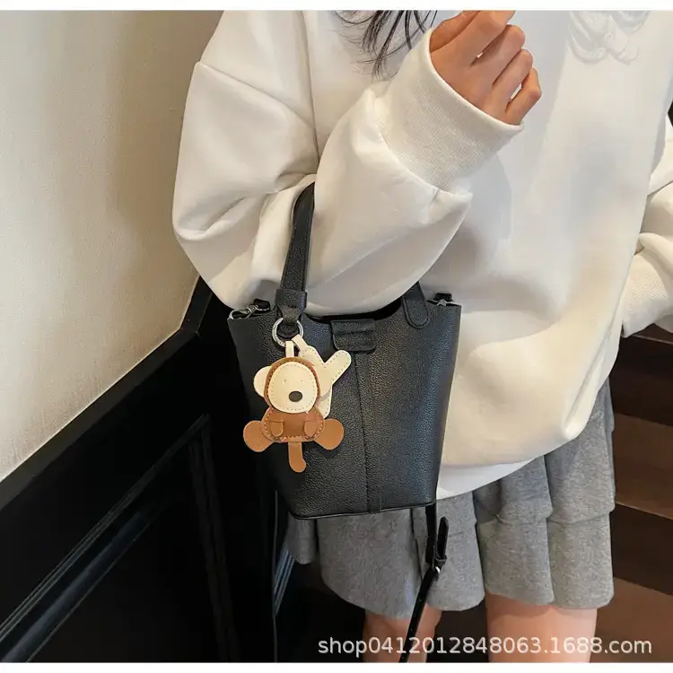 Beige Lychee Bucket Bag with Charm & Strap — feature 18