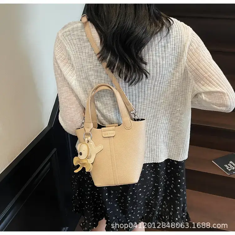 Beige Lychee Bucket Bag with Charm & Strap — feature 19