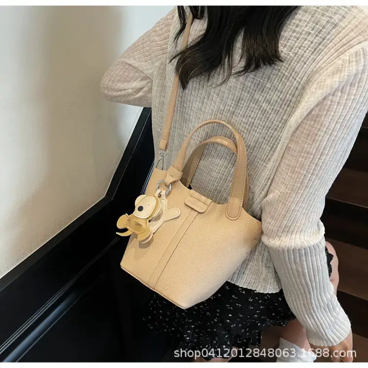 Beige Lychee Bucket Bag with Charm & Strap — feature 20