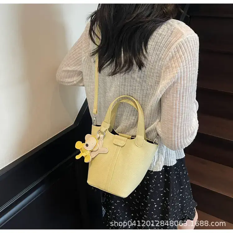 Beige Lychee Bucket Bag with Charm & Strap — feature 23