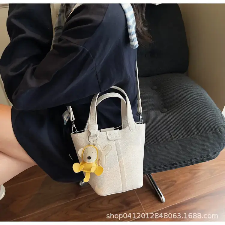 Beige Lychee Bucket Bag with Charm & Strap — feature 27