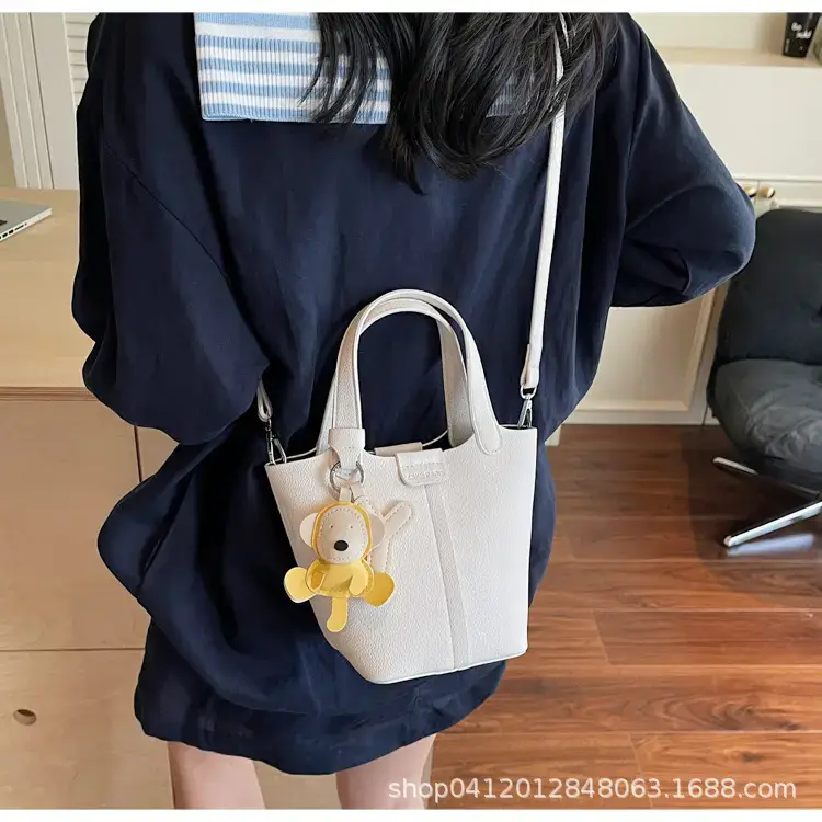 Beige Lychee Bucket Bag with Charm & Strap — feature 28