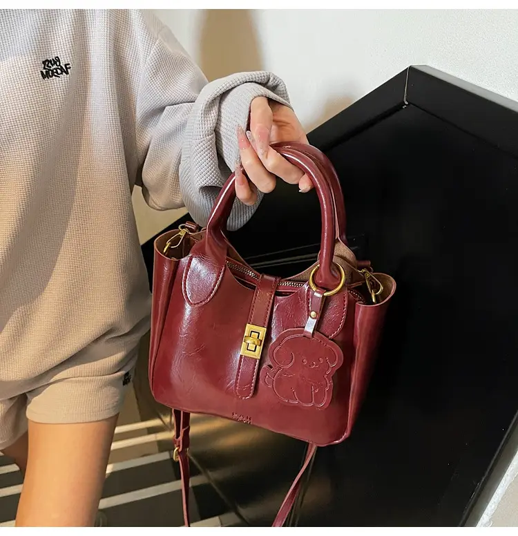 Women's Brown Leather Shoulder Bag with Gold Plated Handles — feature 17