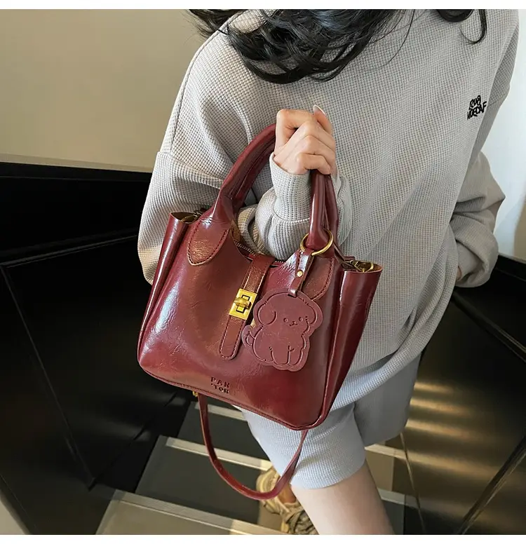 Women's Brown Leather Shoulder Bag with Gold Plated Handles — feature 18