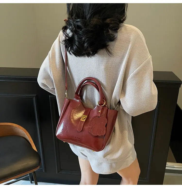 Women's Brown Leather Shoulder Bag with Gold Plated Handles — feature 19