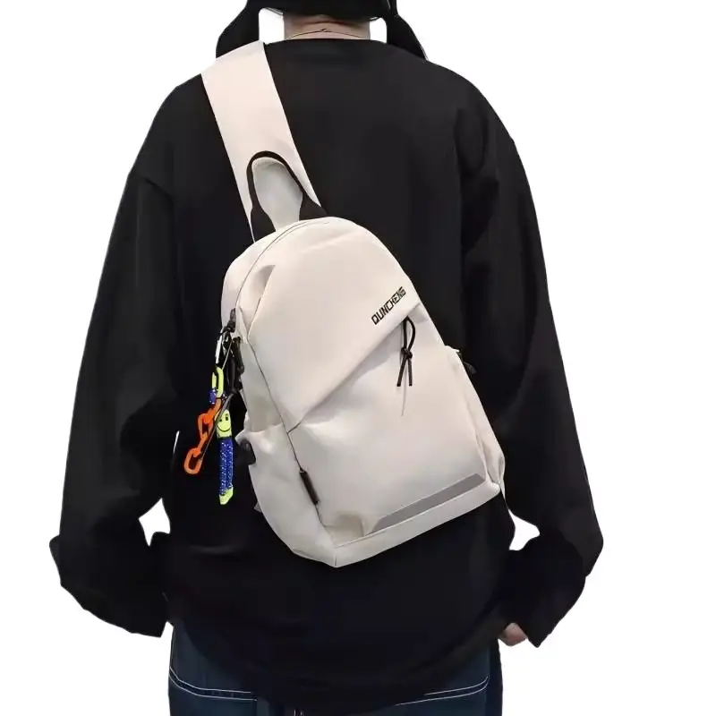 Men's White Crossbody Backpack with Colorful Accessories - Image 9