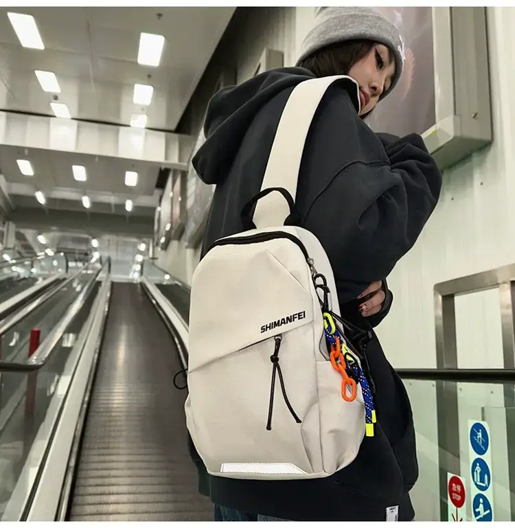 Men's White Crossbody Backpack with Colorful Accessories — feature 14
