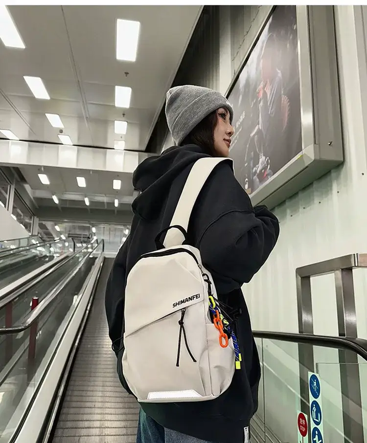 Men's White Crossbody Backpack with Colorful Accessories — feature 2