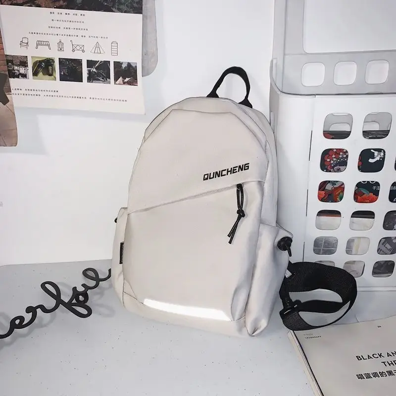 Men's White Crossbody Backpack with Colorful Accessories - Image 2