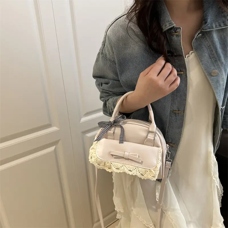Light Blue Crossbody Bag with Bow & Embroidered Strap - Image 6