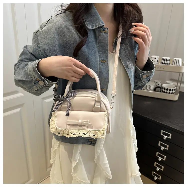 Light Blue Crossbody Bag with Bow & Embroidered Strap — feature 11
