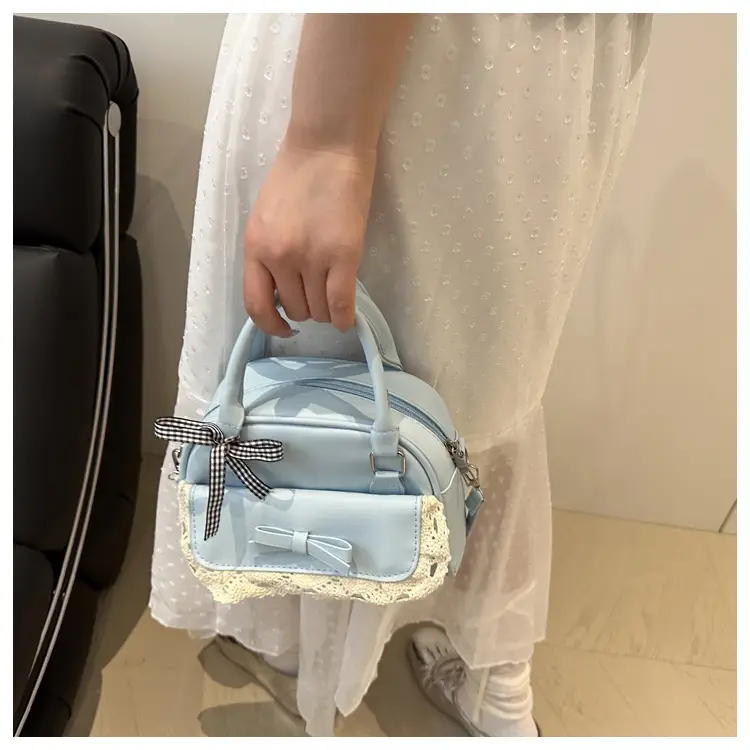 Light Blue Crossbody Bag with Bow & Embroidered Strap — feature 13
