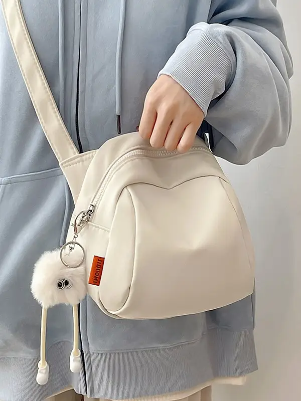 Women's Creamy Shell Shoulder Bag with Pom Pom Charm - Image 4