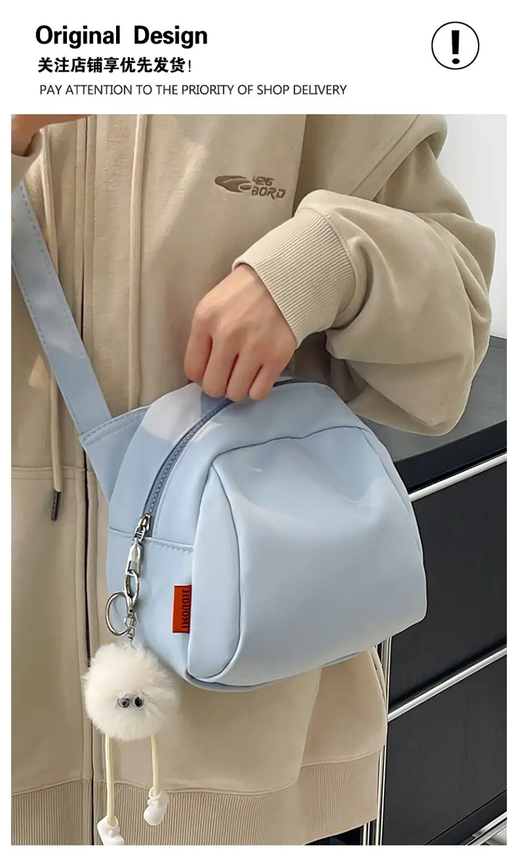 Women's Creamy Shell Shoulder Bag with Pom Pom Charm — feature 1