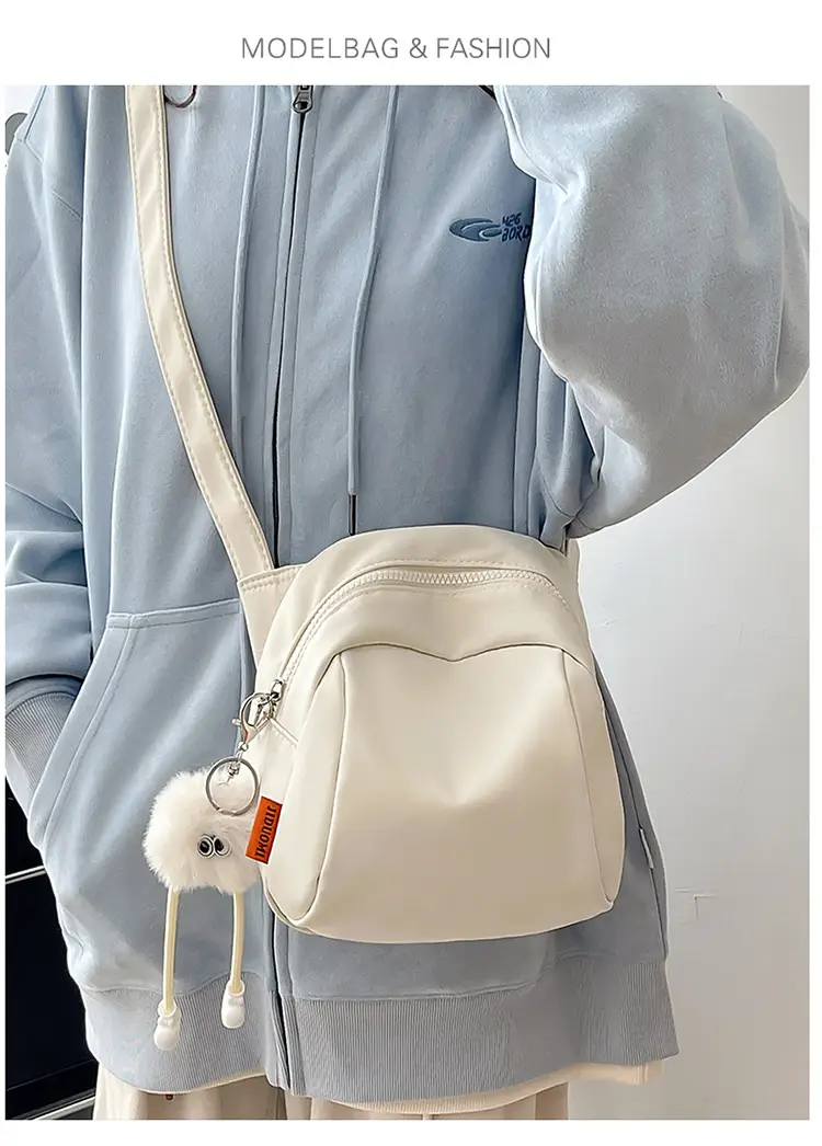 Women's Creamy Shell Shoulder Bag with Pom Pom Charm — feature 16