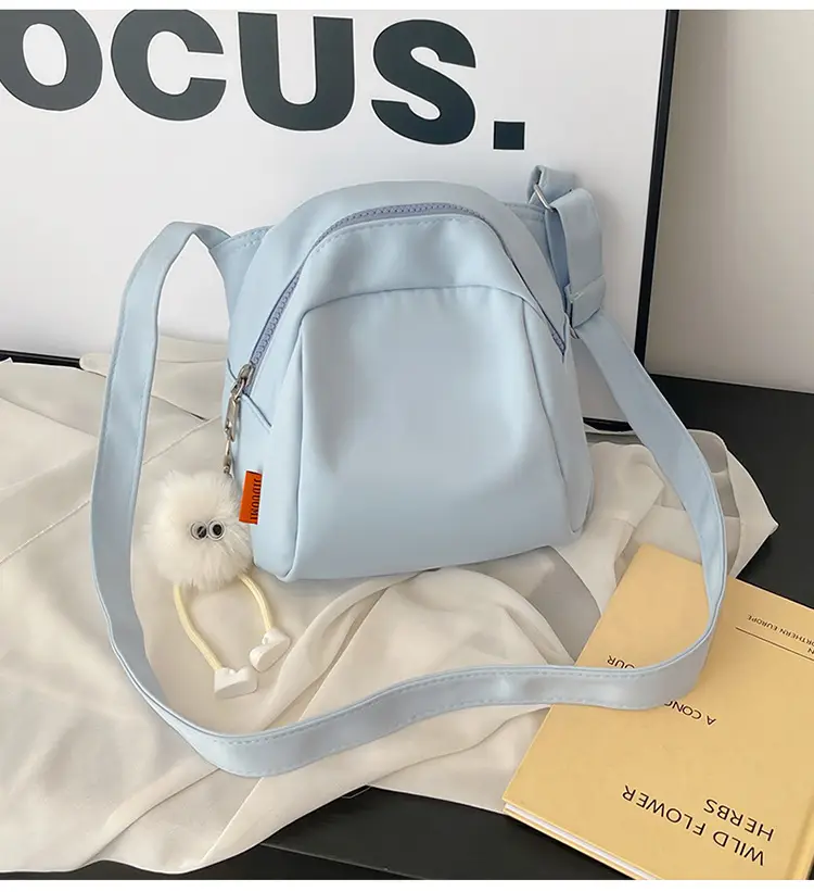 Women's Creamy Shell Shoulder Bag with Pom Pom Charm — feature 25