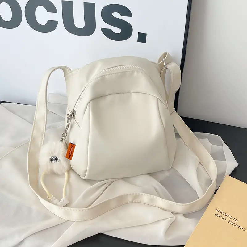 Women's Creamy Shell Shoulder Bag with Pom Pom Charm - Image 3