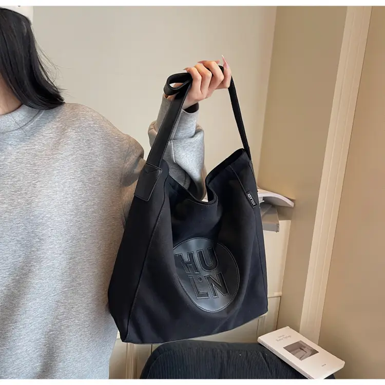 Women's Canvas Crossbody Bag with Logo 2026 — feature 17