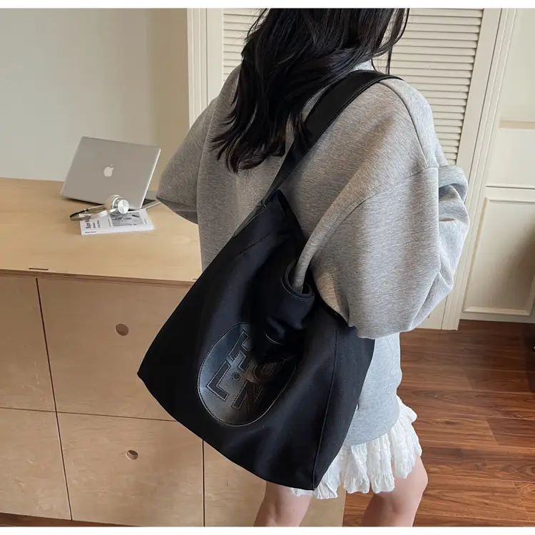 Women's Canvas Crossbody Bag with Logo 2026 — feature 18