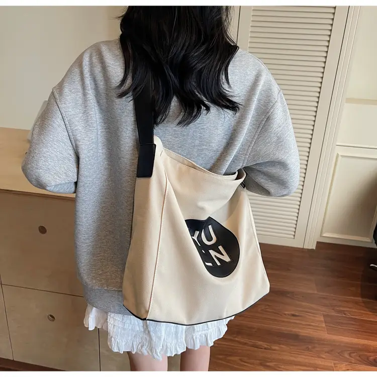 Women's Canvas Crossbody Bag with Logo 2026 — feature 24