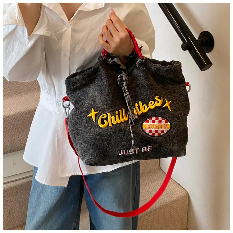 Blue Denim Shoulder Bag with "T Girl Robber" Design — feature 10