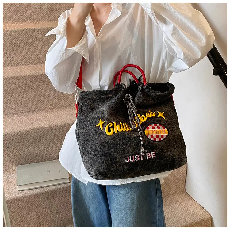 Blue Denim Shoulder Bag with "T Girl Robber" Design — feature 11