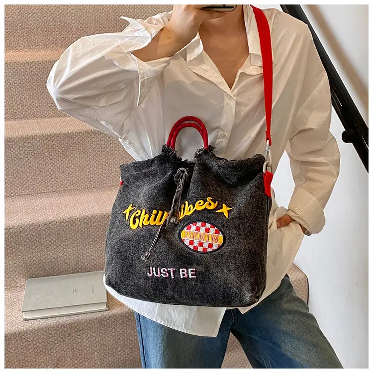 Blue Denim Shoulder Bag with "T Girl Robber" Design — feature 12