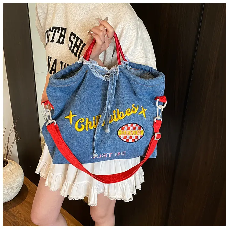 Blue Denim Shoulder Bag with "T Girl Robber" Design — feature 14