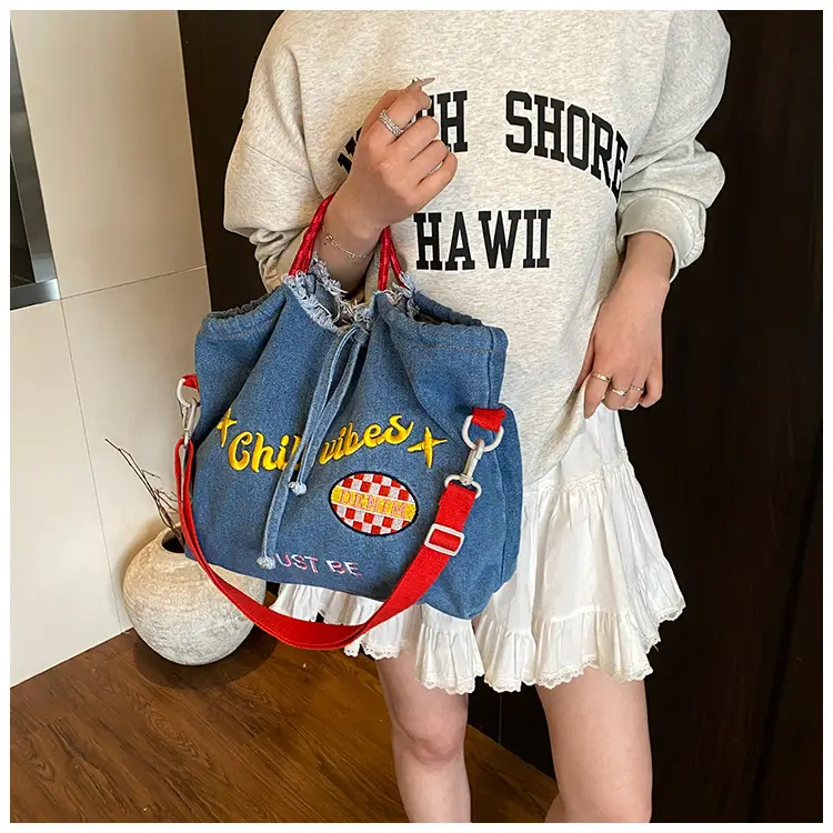 Blue Denim Shoulder Bag with "T Girl Robber" Design — feature 15