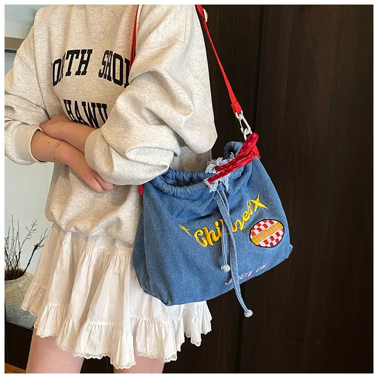 Blue Denim Shoulder Bag with "T Girl Robber" Design — feature 16