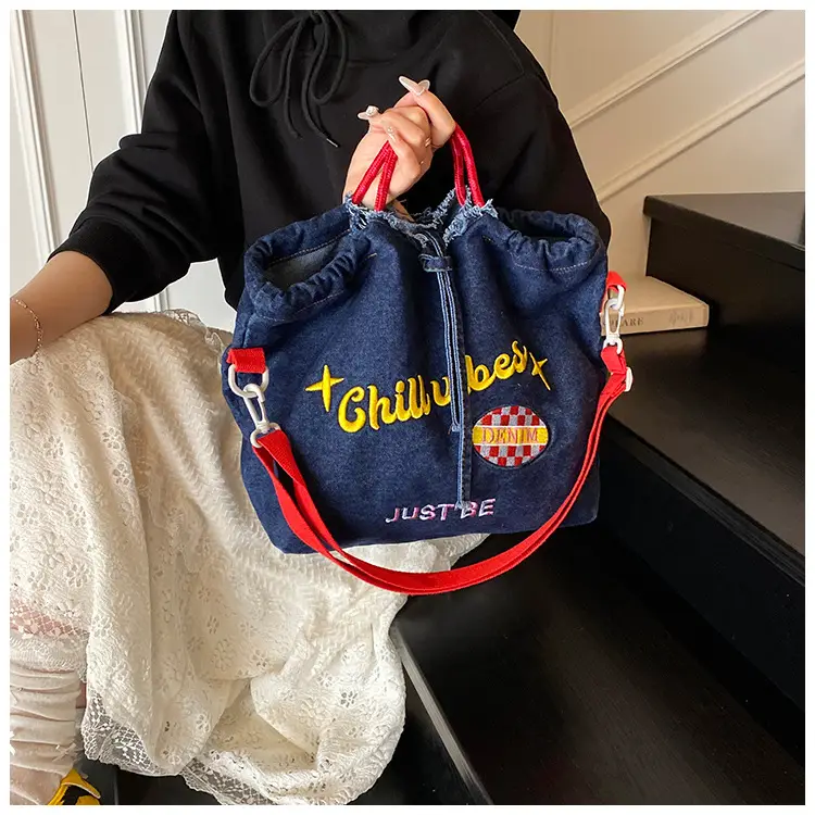Blue Denim Shoulder Bag with "T Girl Robber" Design — feature 18