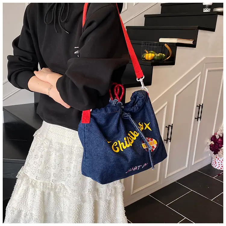 Blue Denim Shoulder Bag with "T Girl Robber" Design — feature 20