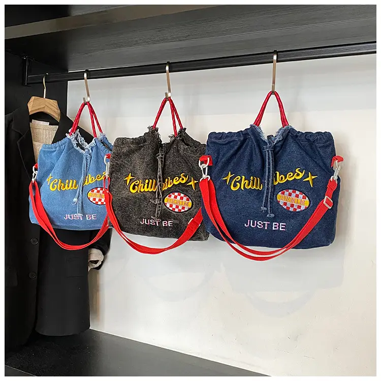 Blue Denim Shoulder Bag with "T Girl Robber" Design — feature 27