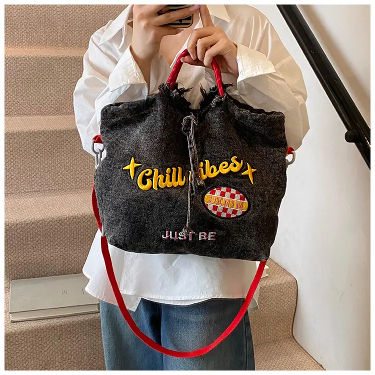 Blue Denim Shoulder Bag with "T Girl Robber" Design — feature 9