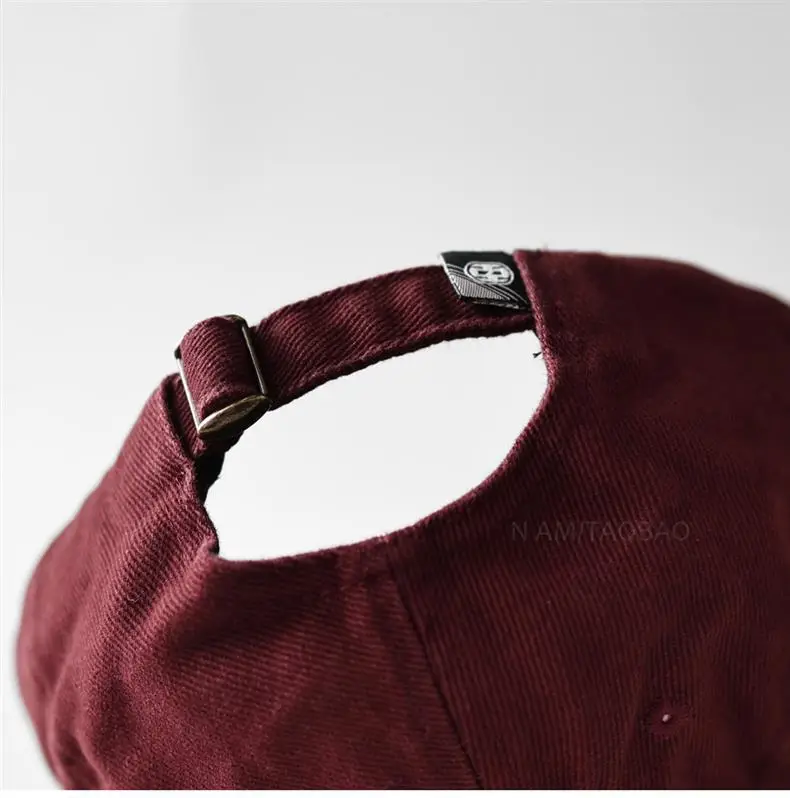 Black American Style Baseball Cap with Embroidered Cross Flower & "MASTUDIO" Text — feature 13