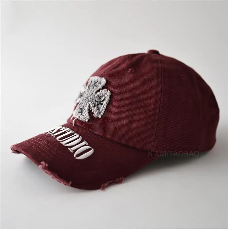 Black American Style Baseball Cap with Embroidered Cross Flower & "MASTUDIO" Text — feature 9