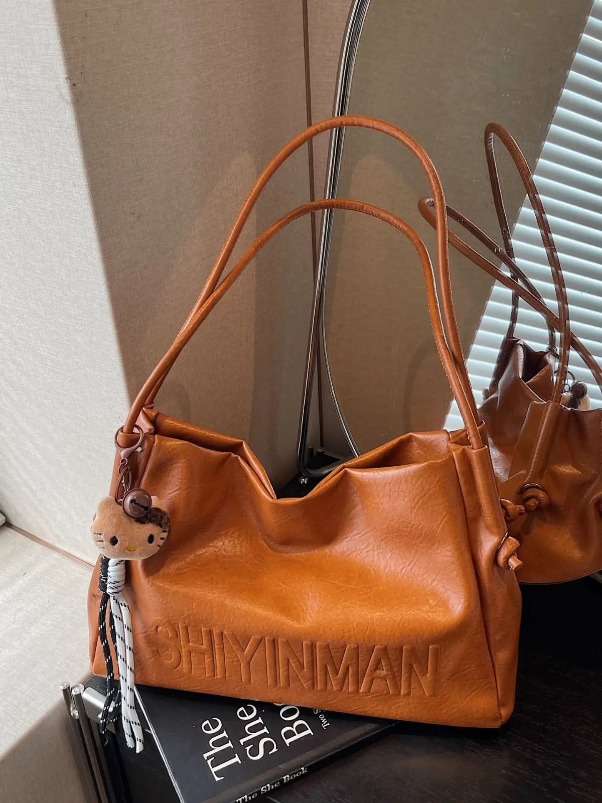Stylish Brown Crossbody Bag with Cute Charm - Image 6