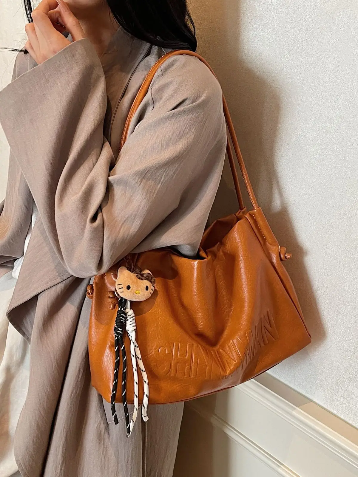 Stylish Brown Crossbody Bag with Cute Charm - Image 8