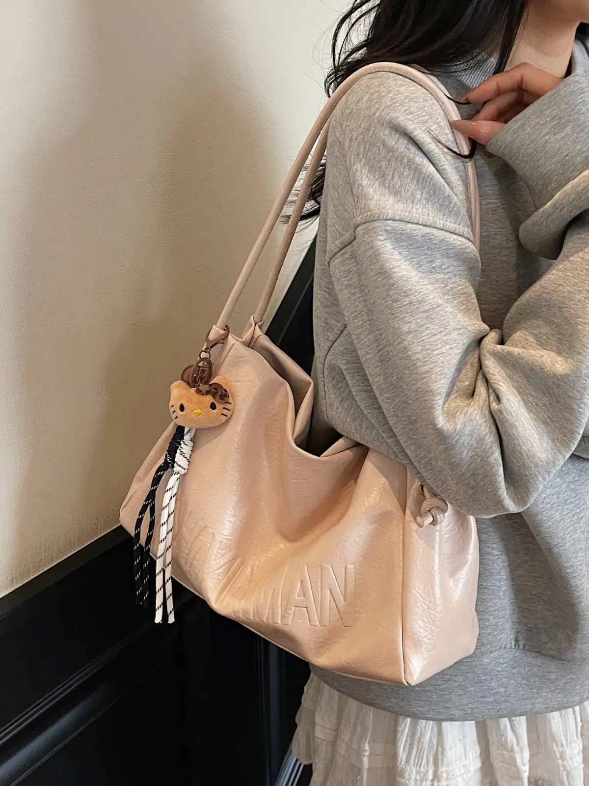 Stylish Brown Crossbody Bag with Cute Charm - Image 9