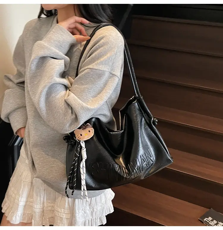 Stylish Brown Crossbody Bag with Cute Charm — feature 5