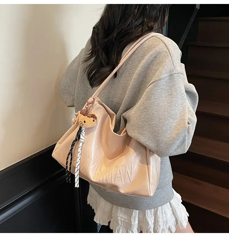 Stylish Brown Crossbody Bag with Cute Charm — feature 6