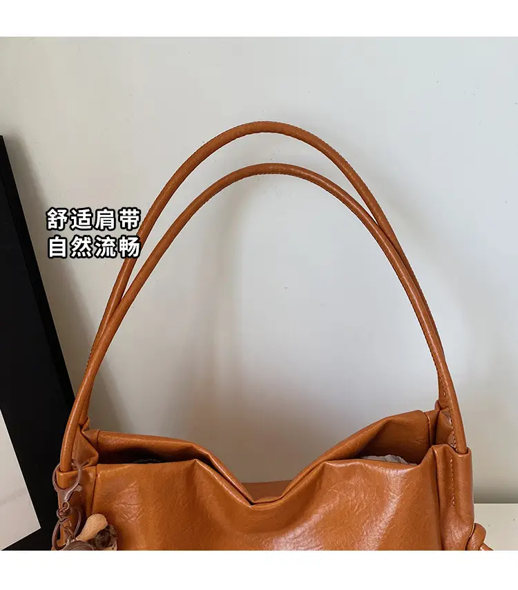 Stylish Brown Crossbody Bag with Cute Charm — feature 7