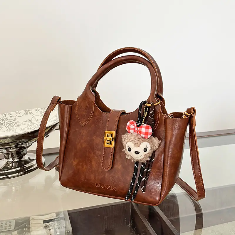 Women Pebbled Shoulder Crossbody Bag with Cute Charm - Image 3