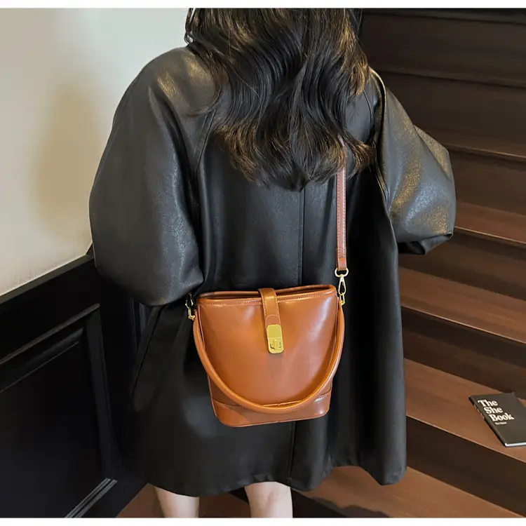 Women's Brown Leather Bucket Bag with Gold Plated Clasp — feature 13