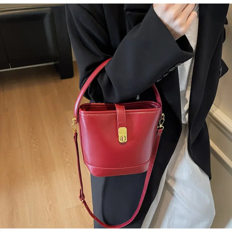 Women's Brown Leather Bucket Bag with Gold Plated Clasp — feature 17